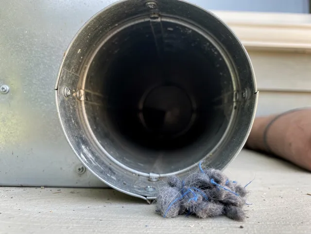 Dublin Dryer Vent Cleaning technician using specialized equipment to clear severe dryer vent blockage in Dublin